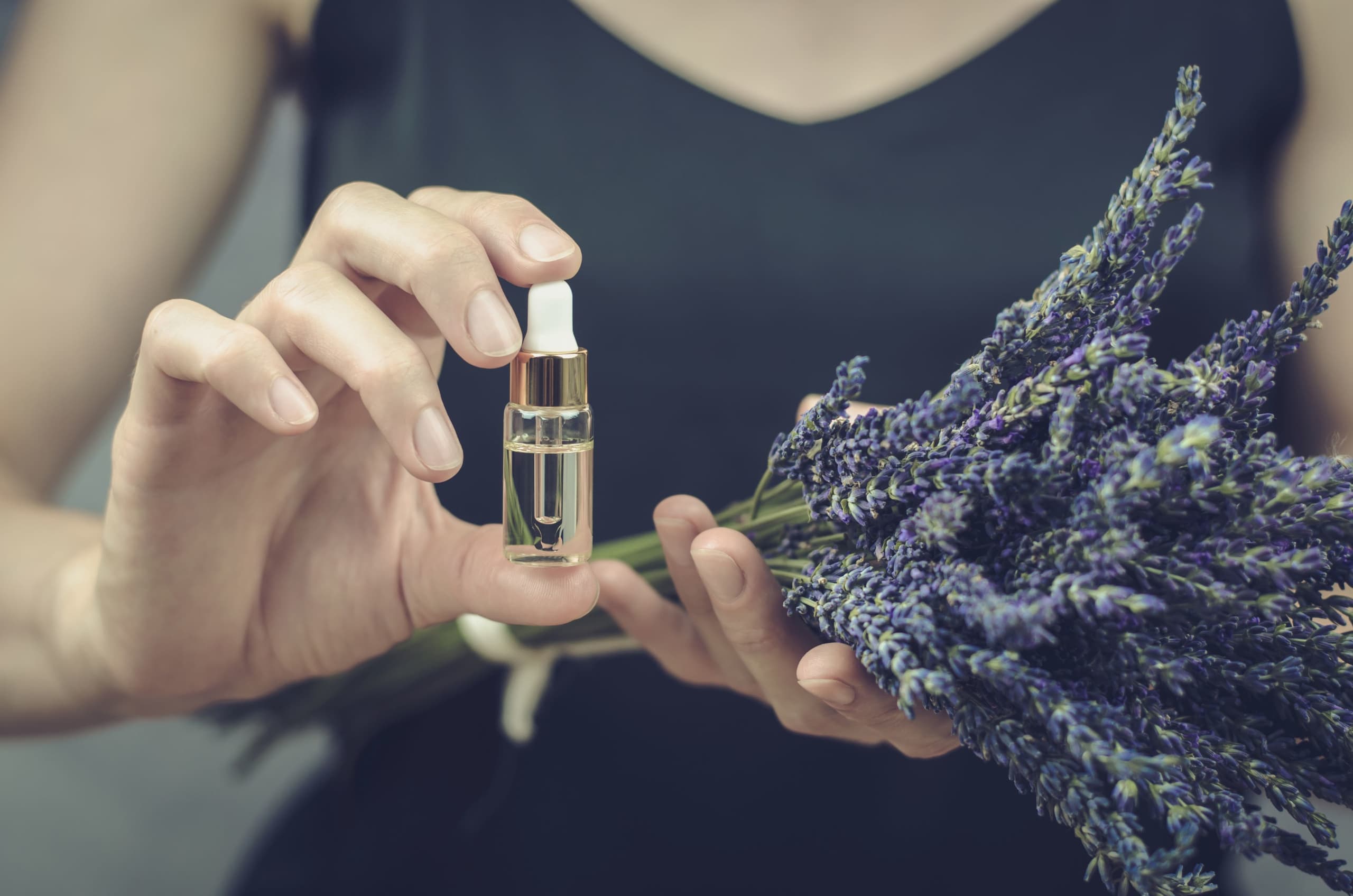 a-woman-holds-lavender-oil-in-her-hands-dropper-b-2023-11-27-04-51-20-utc.jpg